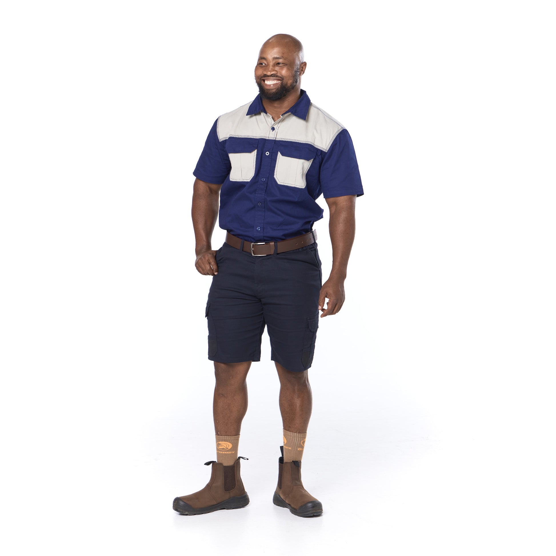 Man wearing a blue and white work shirt with navy shorts on a white background