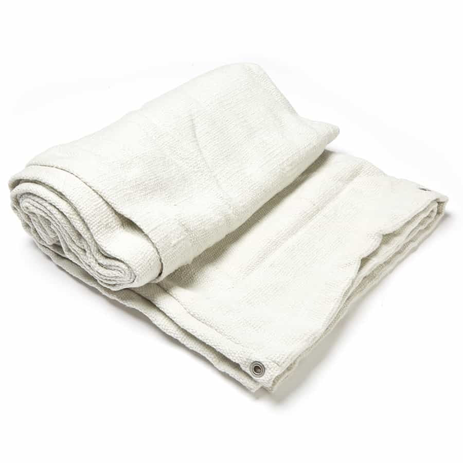 Folded white blanket on a white background
