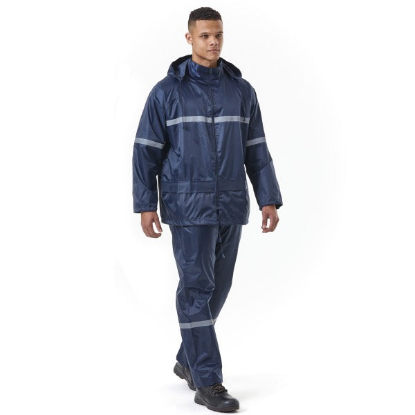 Person wearing a navy raincoat and pants with reflective stripes on a white background