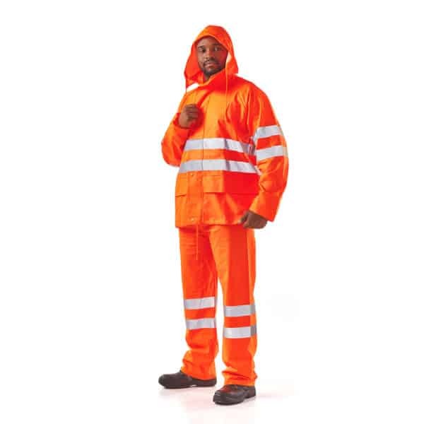 Person wearing an orange rain suit with reflective stripes on a white background